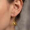 Earring_on_human_ear_2K_202607021515 Gold Plated Leaf Drop Jhumka Earrings