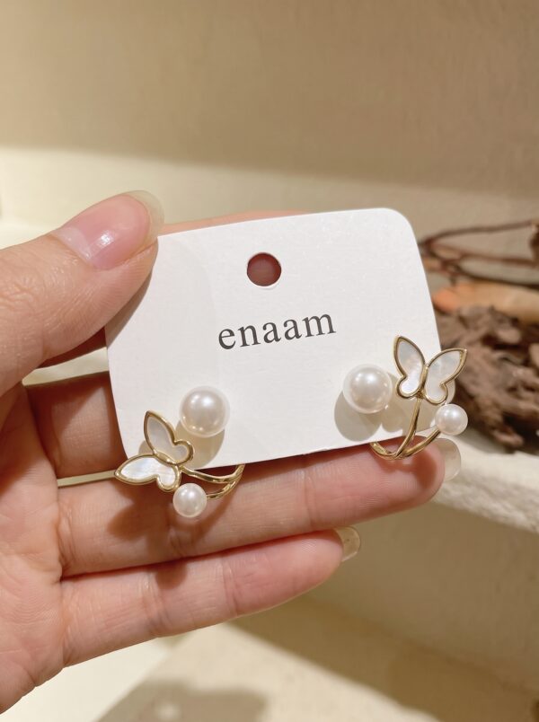 Earrings_held_in_hand_2K_202607021442 Elegant Butterfly Pearl Stud Earrings